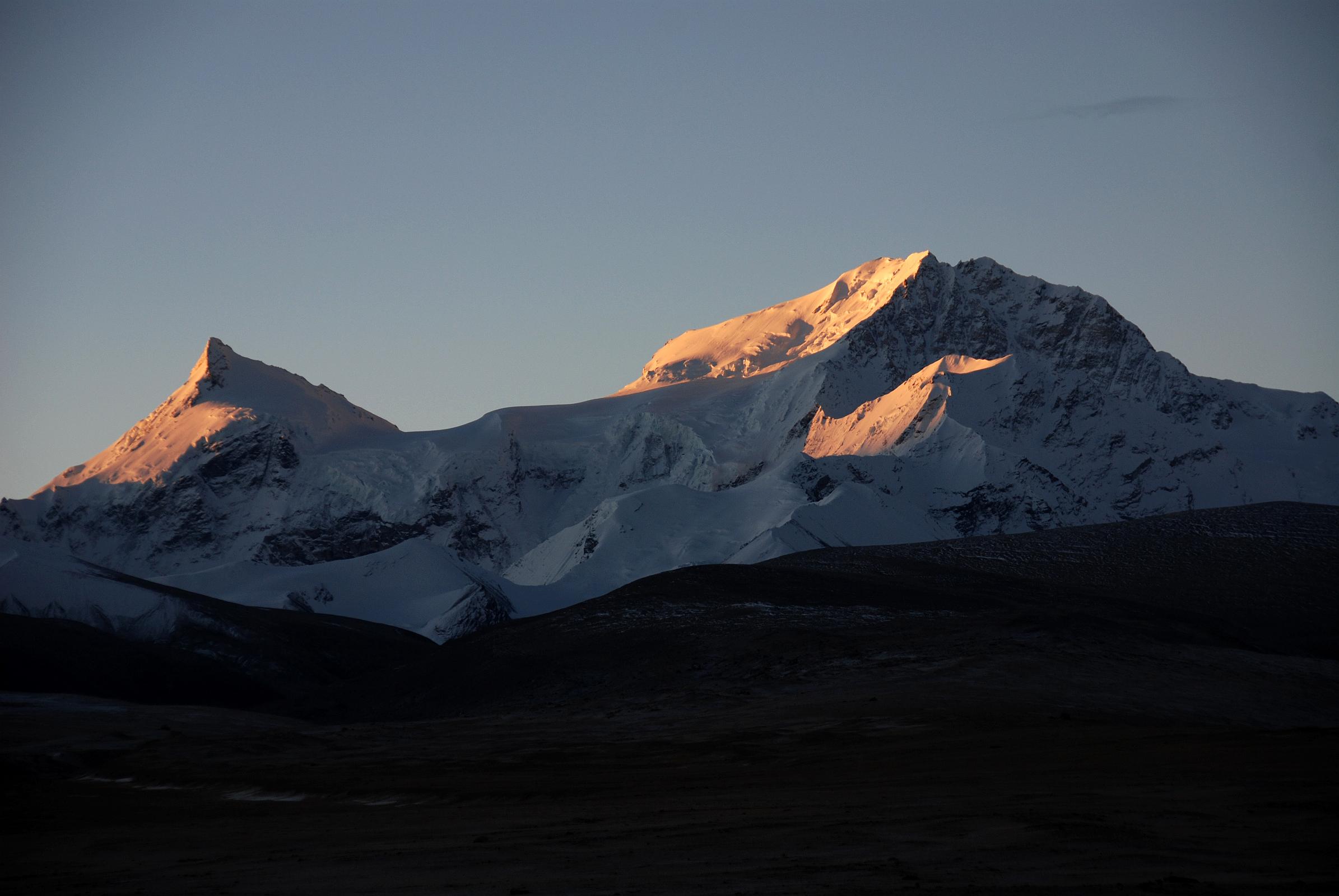 07 Sunrise On Phola Gangchen And Shishapangma East Face From Shishapangma North Base Camp Phola Gangchen (7661m) and Shishapangma East Face shine at sunrise from Shishapangma North Base Camp (5029m).